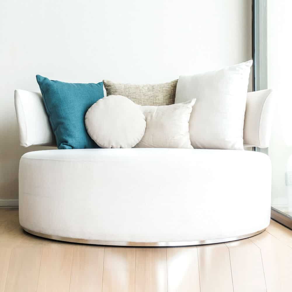 Modern white round sofa Seward Associates